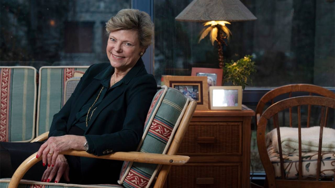 Cokie Roberts sitting in an arm chair at her home. Next Avenue