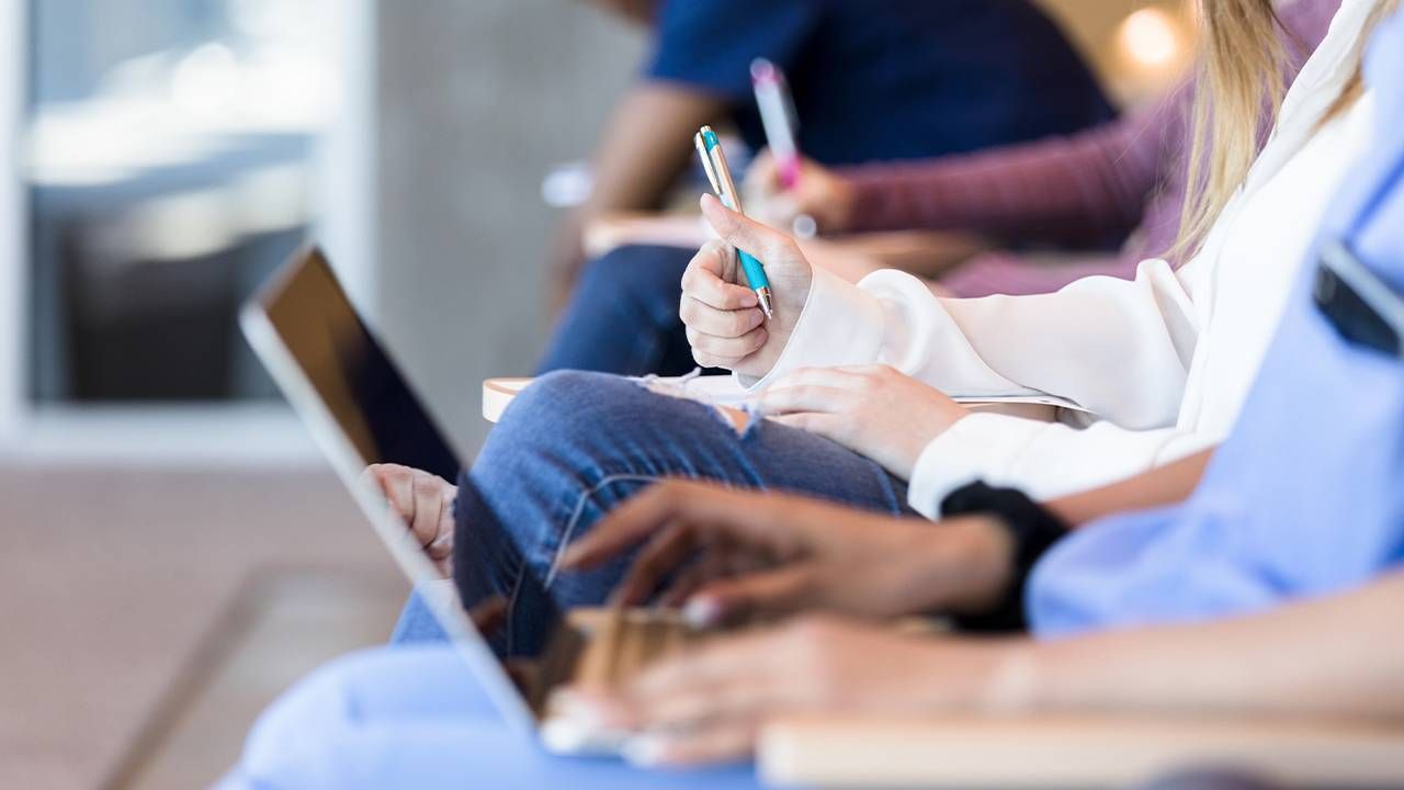 A close-up of medical students in a college classroom. University of Arizona end of life education