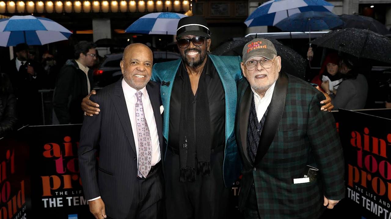 Three men standing arm-in-arm outside on the red carpet for a Broadway opening night show. Next Avenue, Berry Gordy, Motown