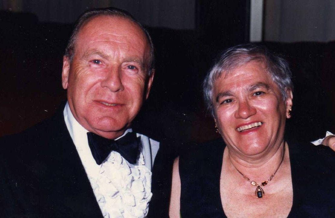 A couple smiling, dressed up in black tie event clothing. Next Avenue, ageism doctors nurses