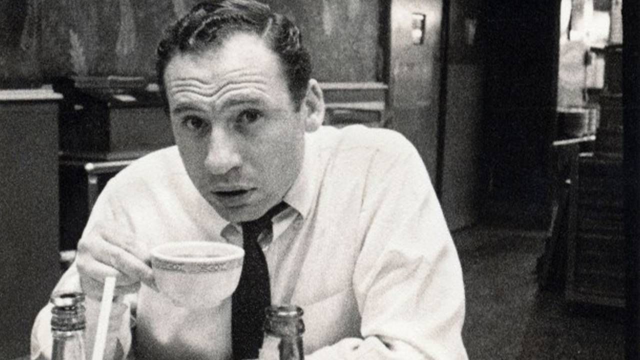 A black and white photo of Mel Brooks sipping on a cup of tea. Next Avenue