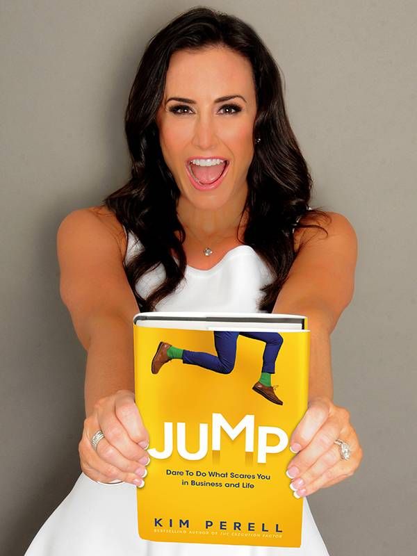 An author holding up her book titled, Jump by Kim Perell. Next Avenue, business success plan