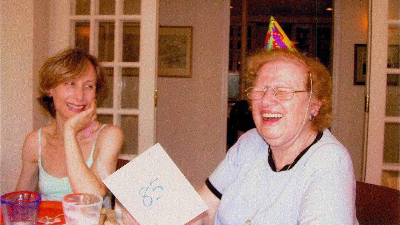 The writer sitting next to her mother at her 85th birthday party. Next Avenue, caregiver, doctors