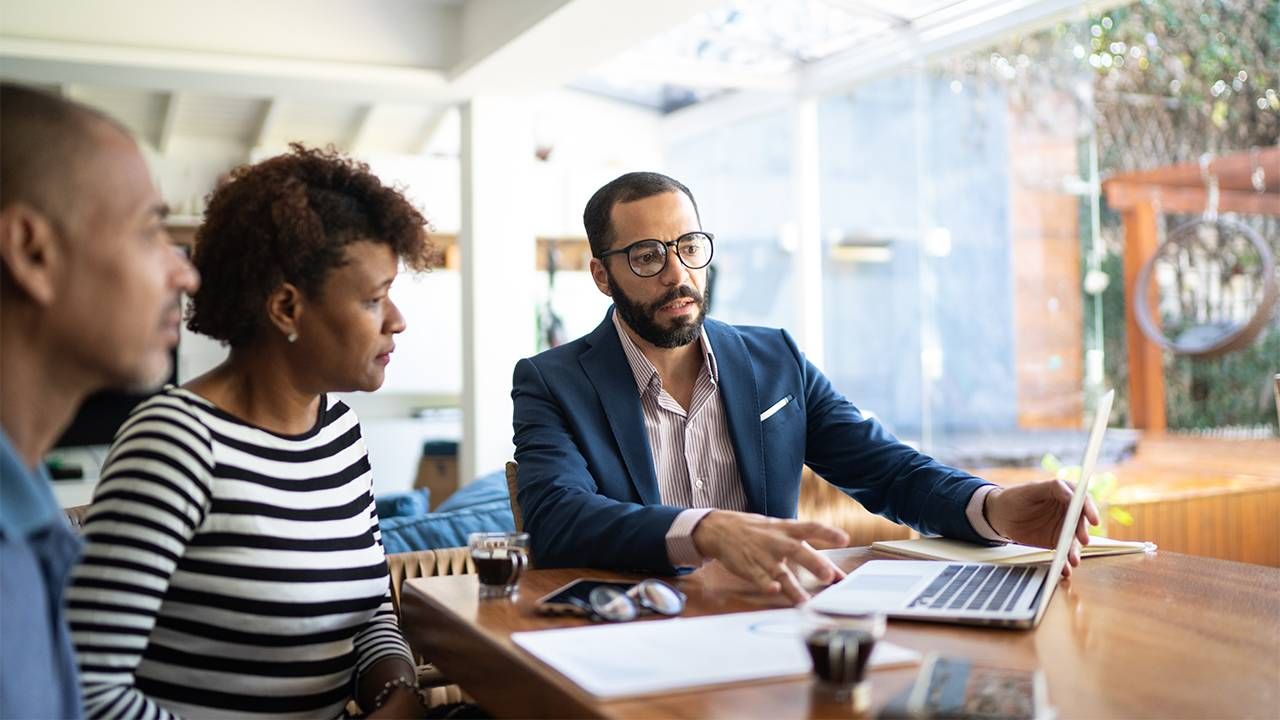 A Gen X couple meeting with a financial planner. Next Avenue