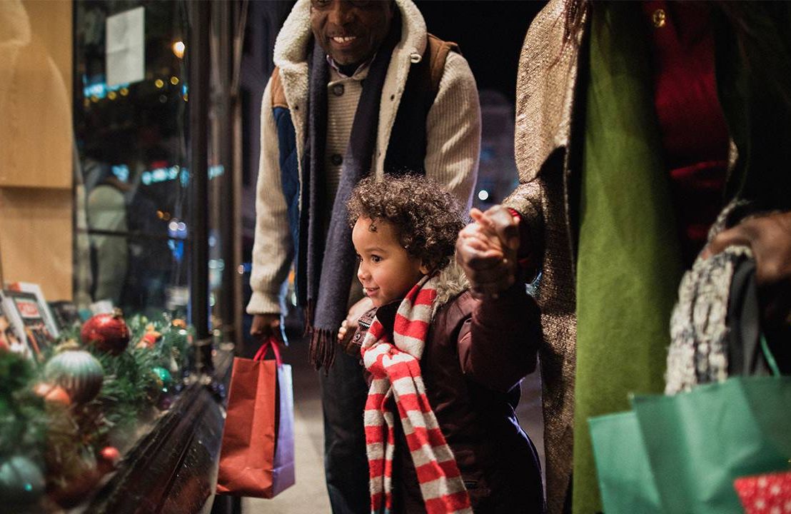 Grandparents window shopping with their grandchild. Next Avenue, gift ideas