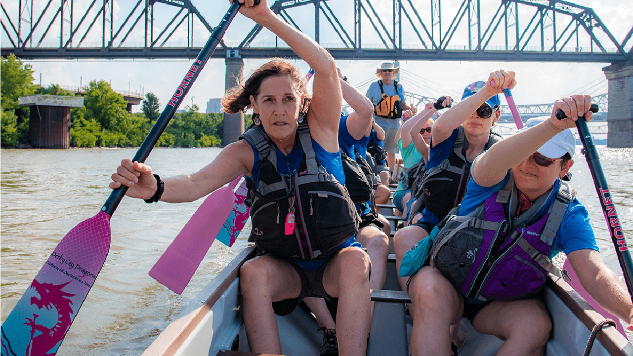 A group of people rowing in a river. Next Avenue