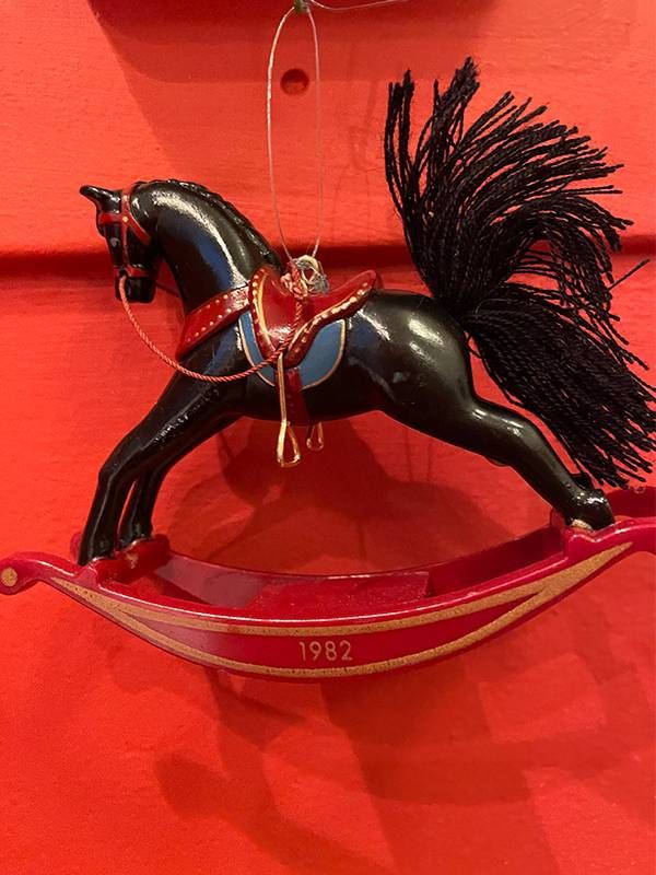 A close-up of a rocking horse christmas tree ornament. Next Avenue, christmas ornaments memories