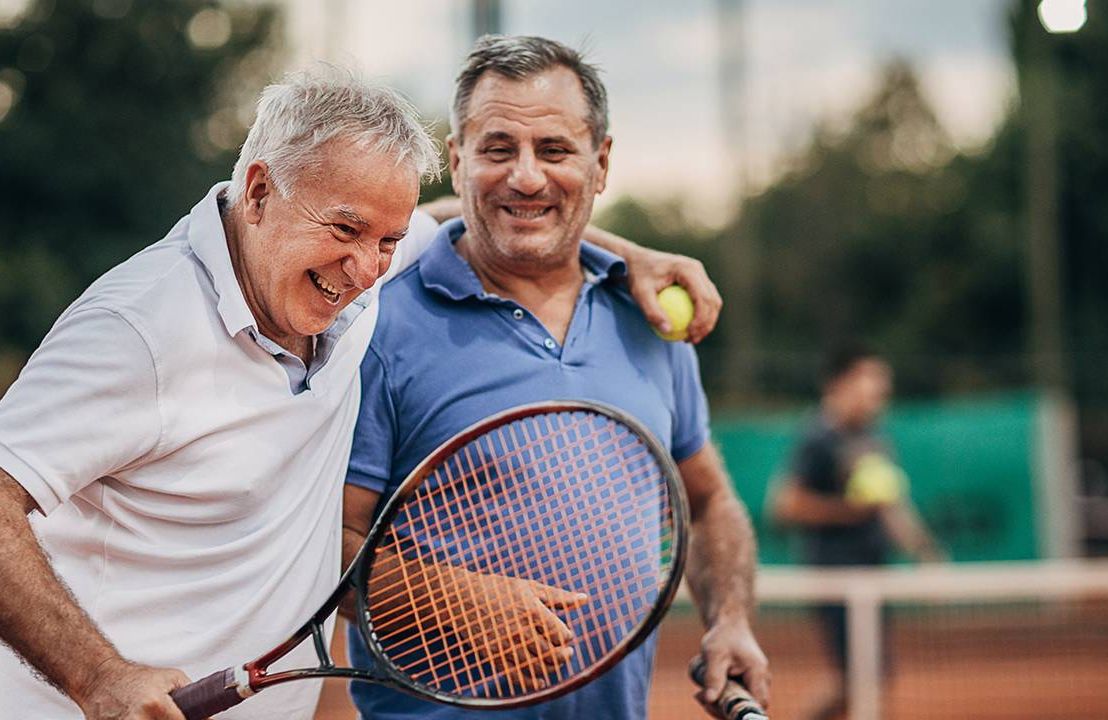Two retired friends laughing after playing tennis. Next Avenue