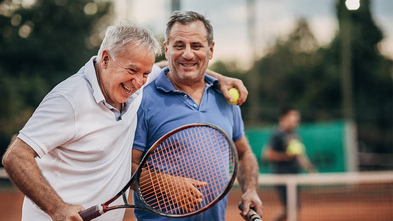 Two retired friends laughing after playing tennis. Next Avenue