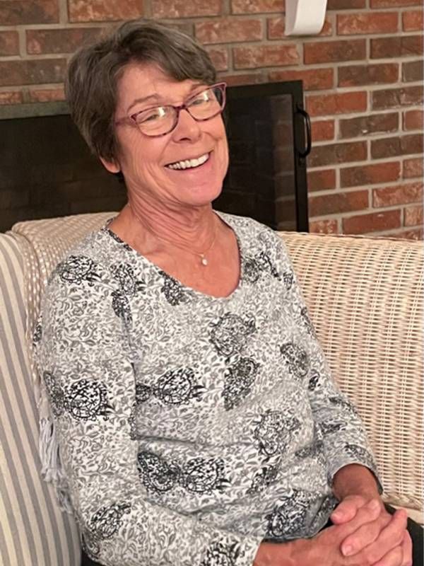 A woman wearing a patterned blouse and glasses smiling. Next Avenue, retirement, spend sculpt time