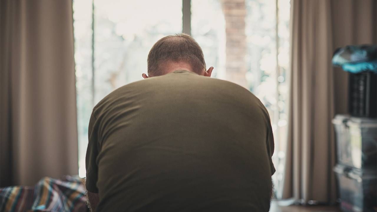 An older adult slouching with bad posture. Next Avenue