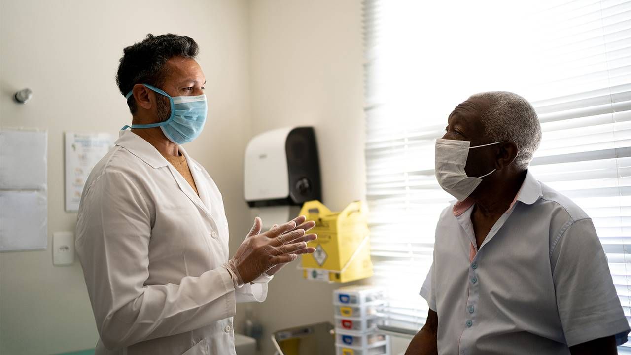 An older adult talking to doctor about prostate cancer. Next Avenue, Black and Latino men