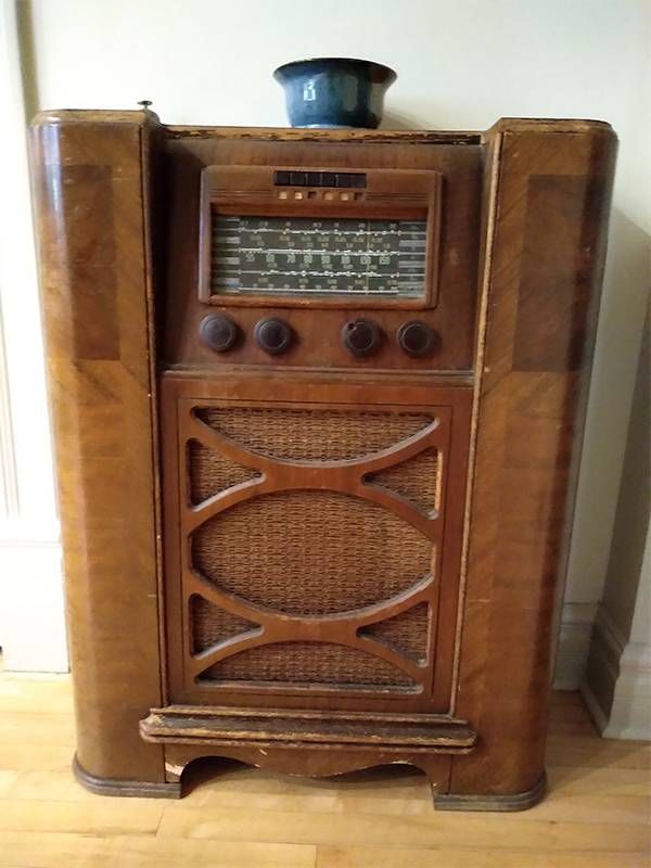 A large wooden antique radio. Next Avenue, downsizing, decluttering, relationship conflict