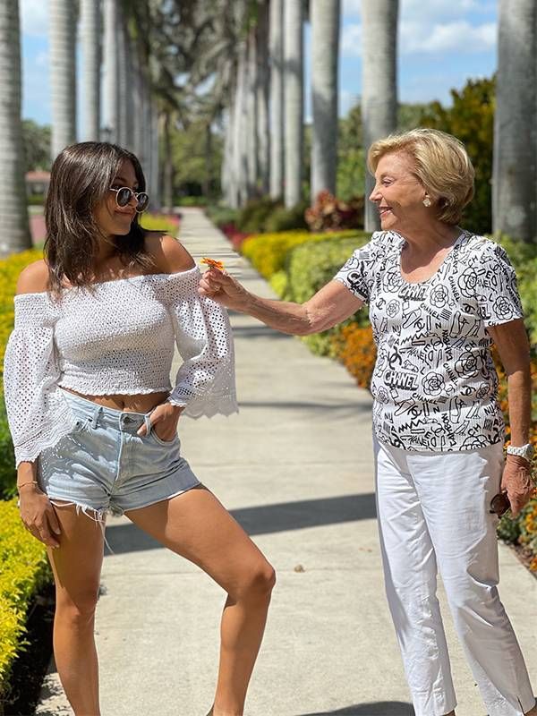 A grandmother handing a flower to her granddaughter. Next Avenue, dating advice