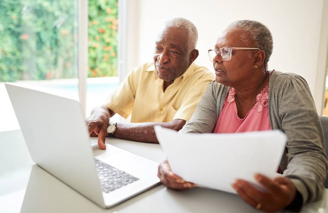 An older couple on the computer planning out their long term care options. Next Avenue