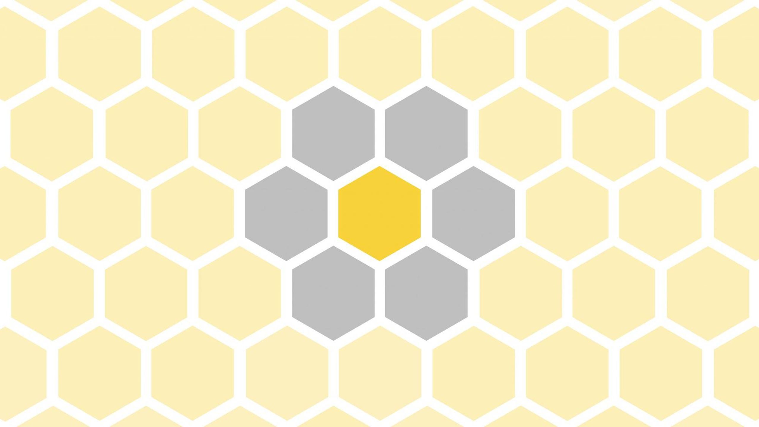 A repeated pattern of hexagonal shapes in a panagram style. Next Avenue, Spelling Bee Game, panagram