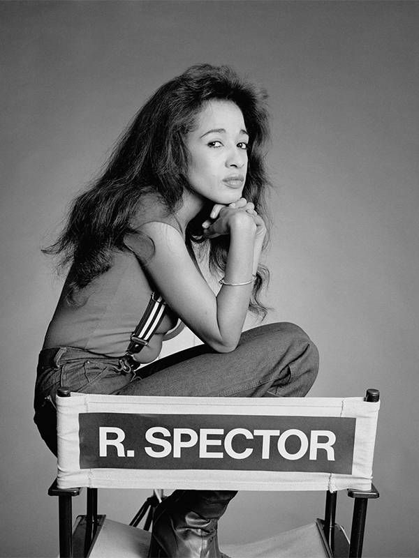 A black and white photo of Ronnie Spector sitting on a director's chair. Next Avenue, mourn, death, grief