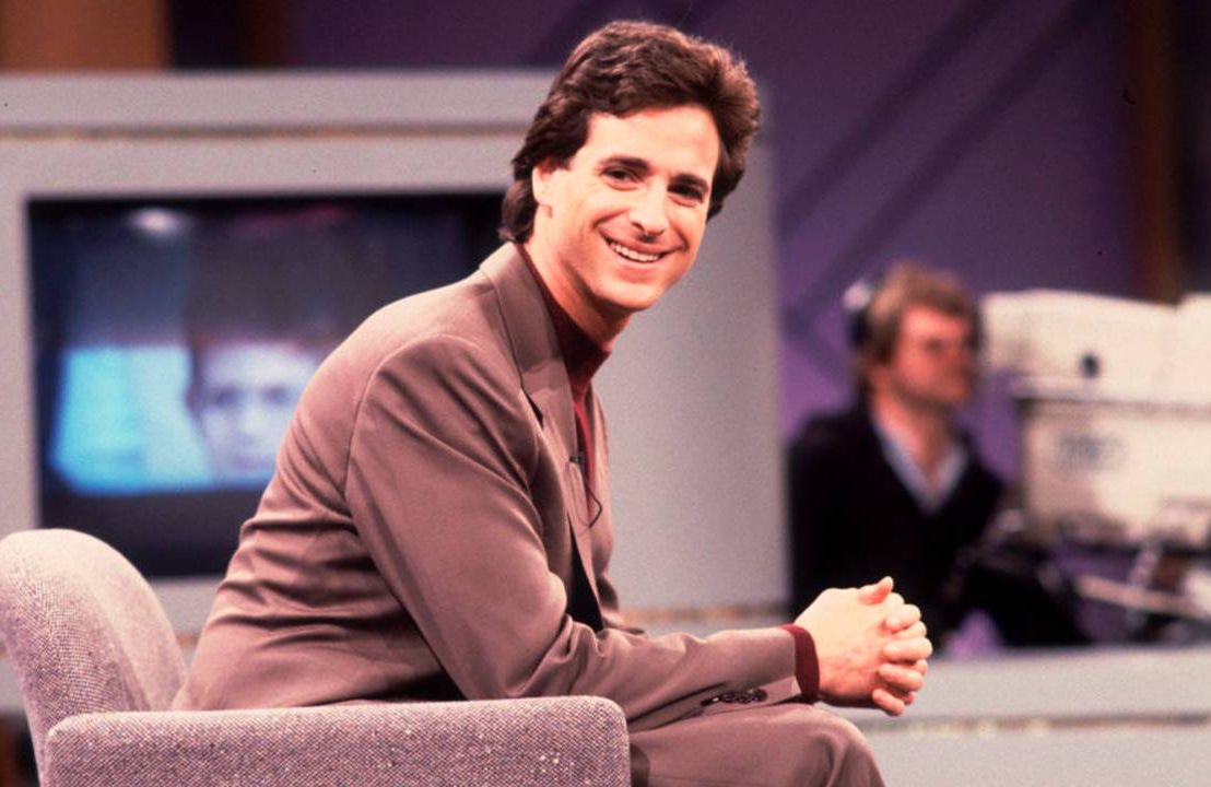 The actor Bob Saget wearing a suit while on set of a talk show. Next Avenue, mourn, death, grief