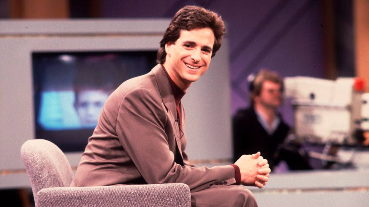 The actor Bob Saget wearing a suit while on set of a talk show. Next Avenue, mourn, death, grief