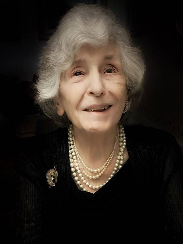 A photo of an older woman wearing a black dress and pearls. Next Avenue, palliative care, caregiving