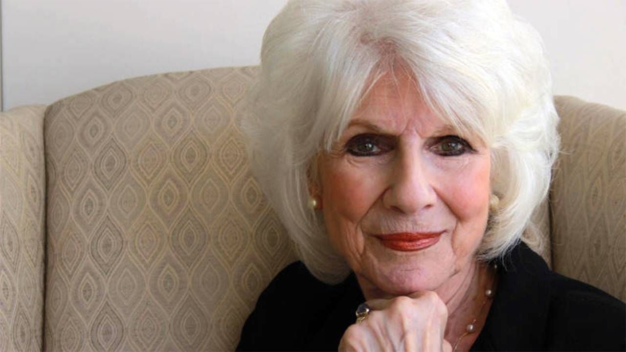 Diane Rehm smiling while sitting in a chair. Next Avenue, medical aid in dying