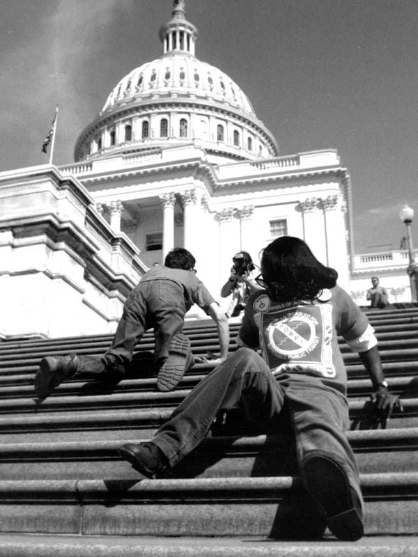 Disability rights activists crawling up the steps of the U.S. capital. Next Avenue, history of disability rights movement
