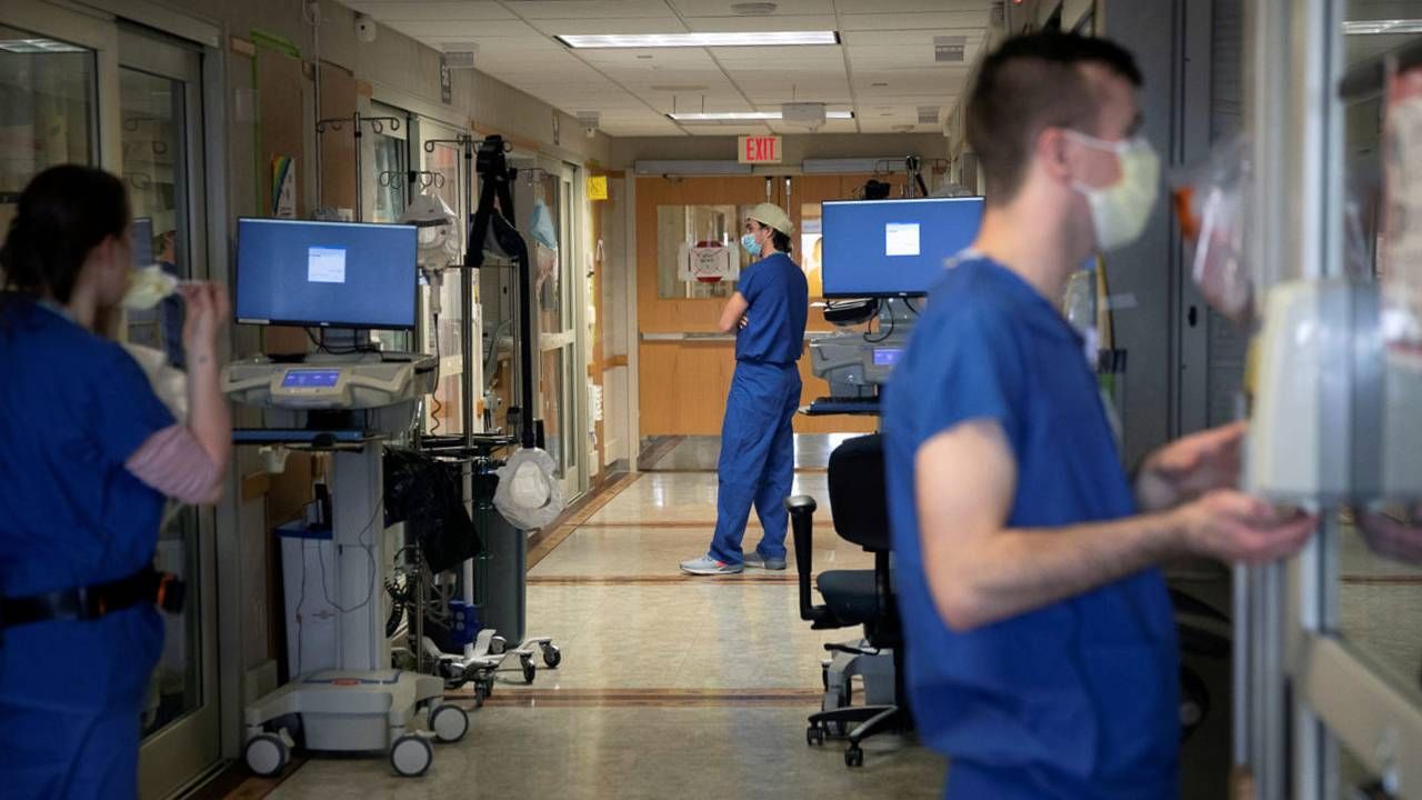 The hallway of a hospital emergency room where doctors are treating patients with chest pain. Next Avenue