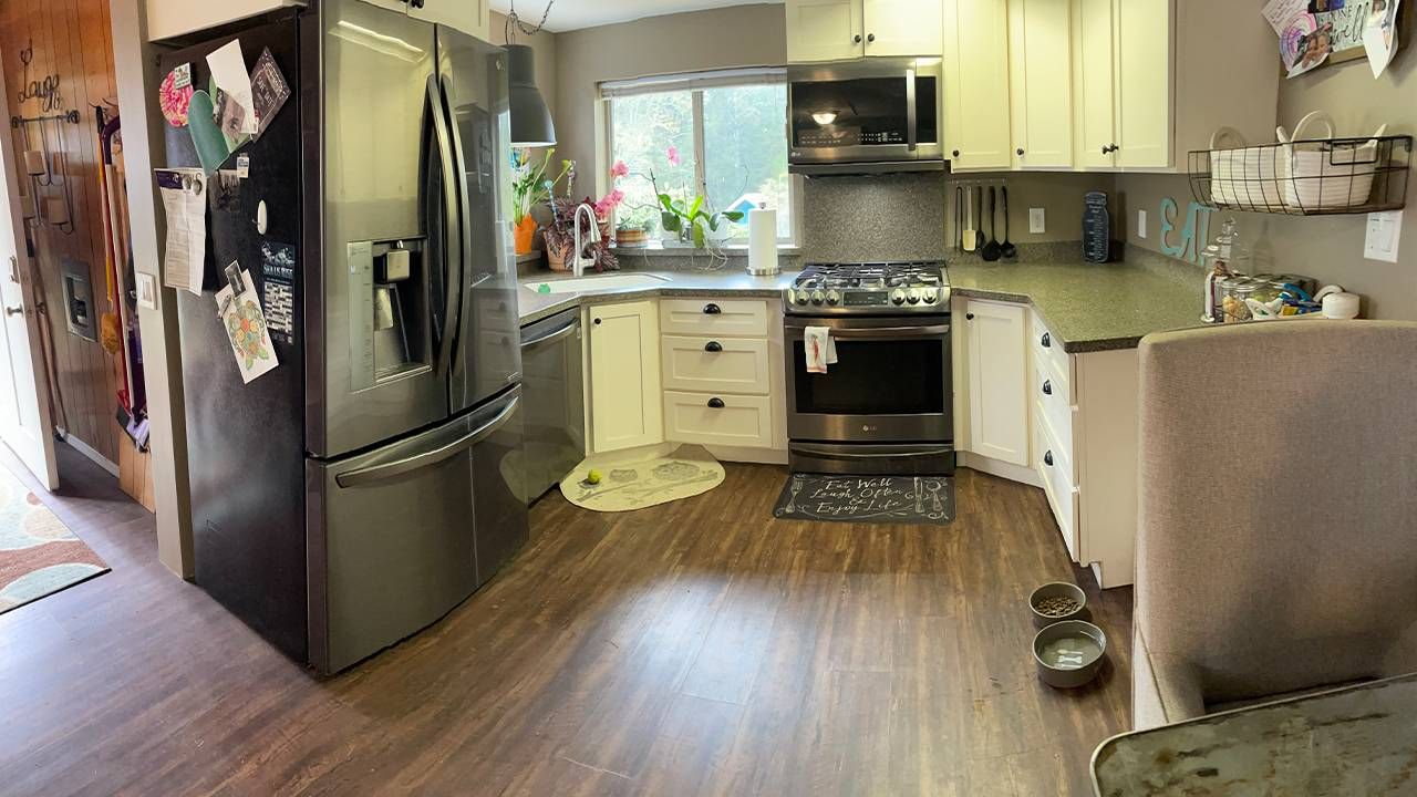 The interior of a tiny house, the kitchen and entry way. Next Avenue, tiny house movement