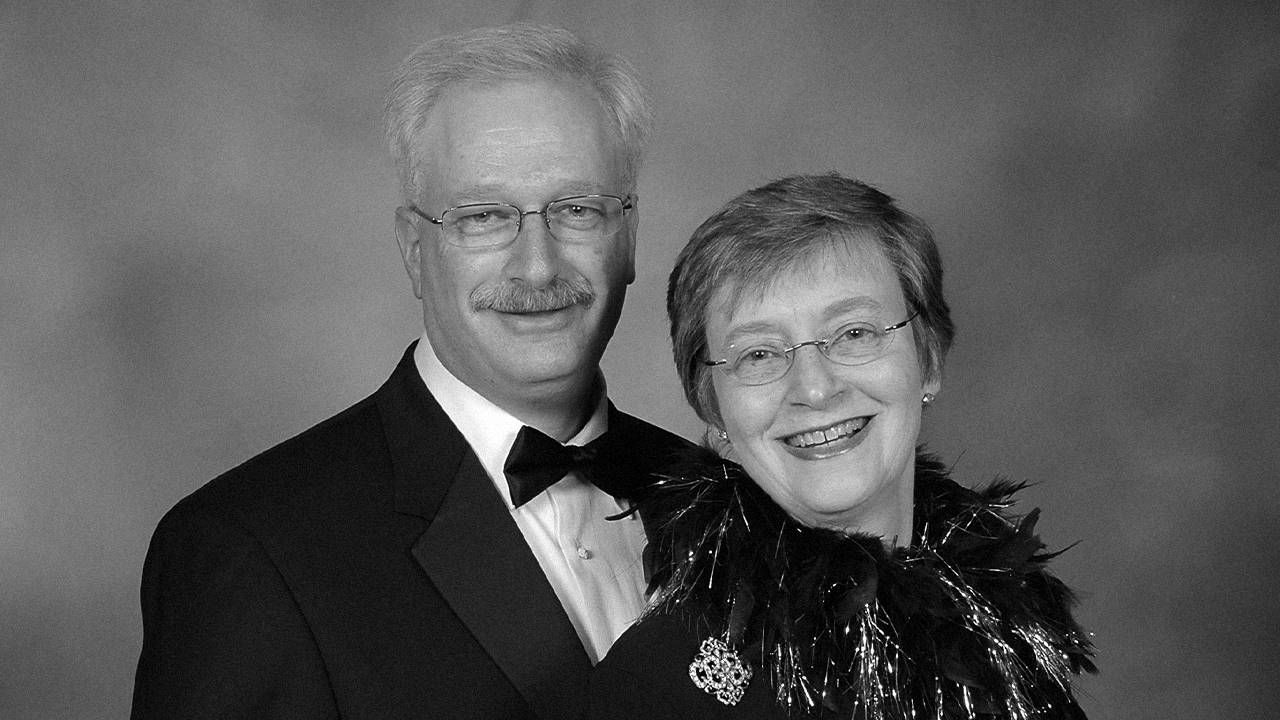 A husband and wife wearing formal attire and smiling. Next Avenue, bereavement, grief, widow