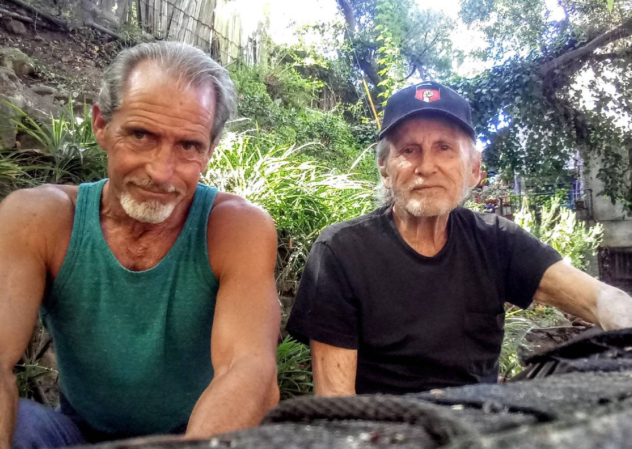 Two men sitting outside. Next Avenue, Father Knows Best