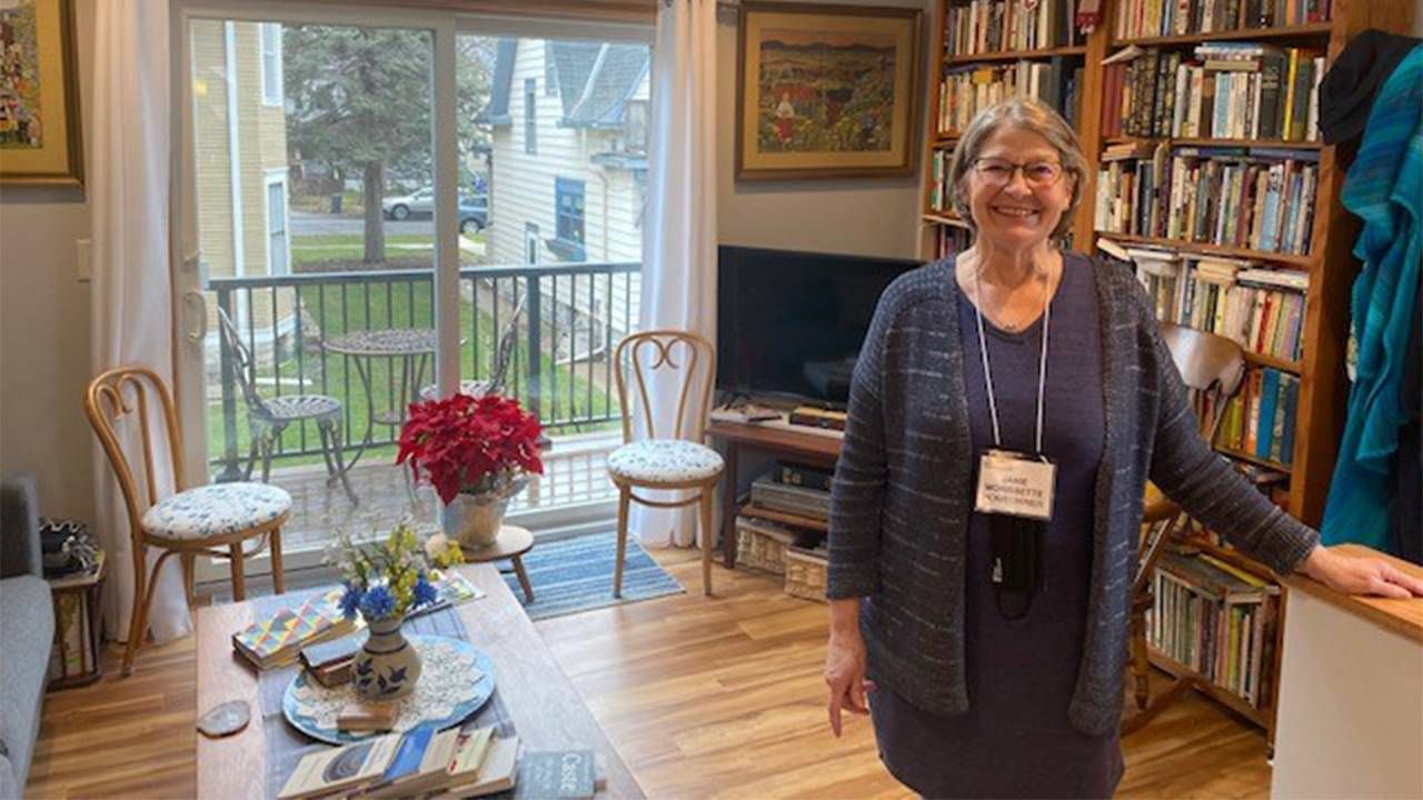 A woman standing in her ADU Accessory Dwelling Unit. Next Avenue,