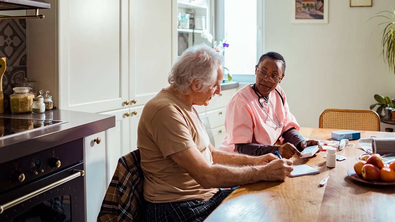 A nurse visiting a senior at home. Next Avenue, Naturally Occurring Retirement Community, NORC