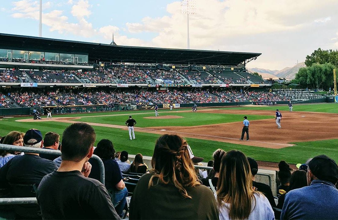 A mother and son at a baseball game. Next Avenue, baseball road trip