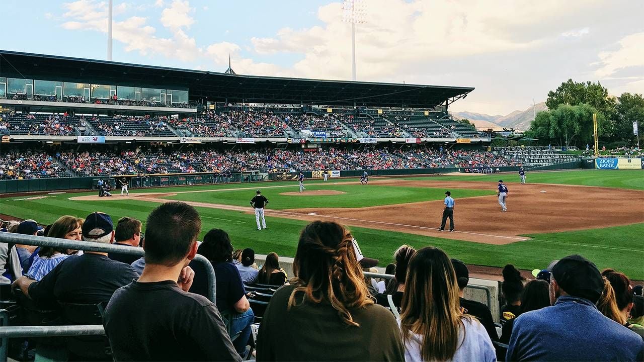 A mother and son at a baseball game. Next Avenue, baseball road trip