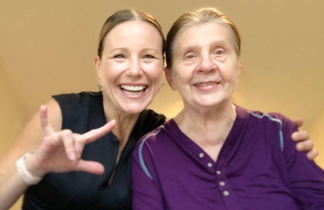 A woman using sign language and sitting with her mother who is deaf and has dementia. Next Avenue, Child/children of deaf adults caregiving CODA