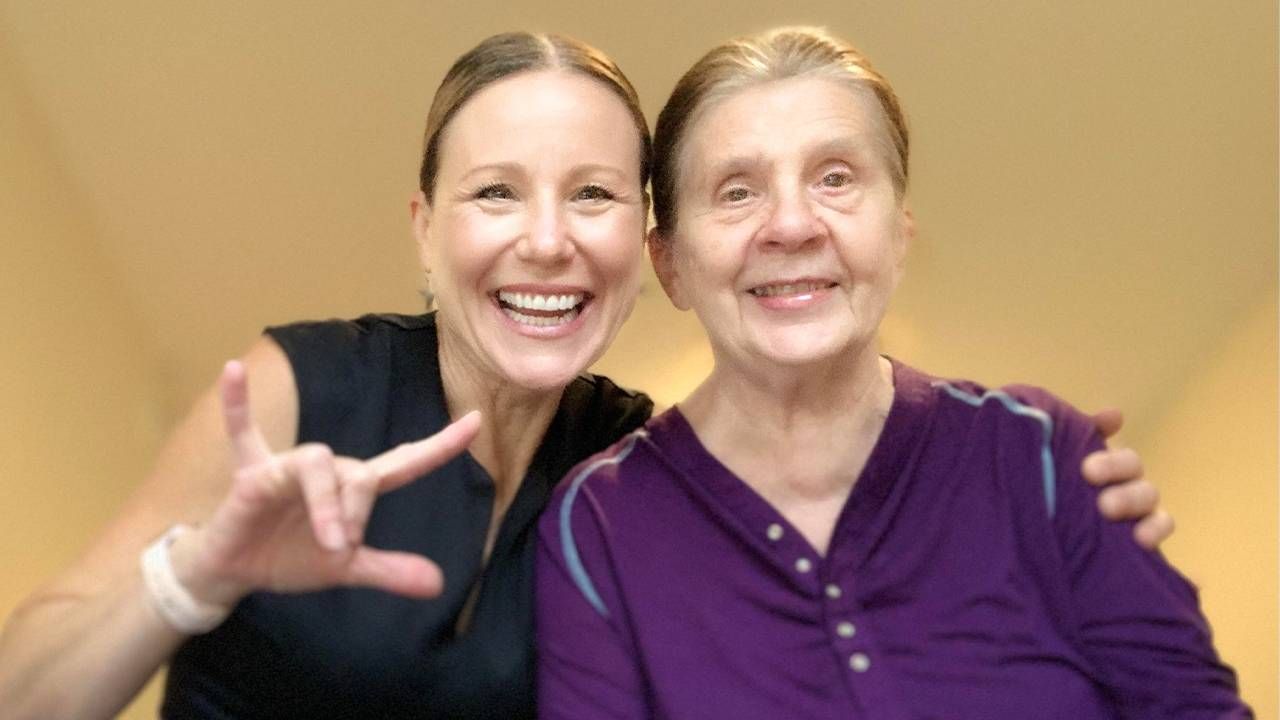 A woman using sign language and sitting with her mother who is deaf and has dementia. Next Avenue, Child/children of deaf adults caregiving CODA