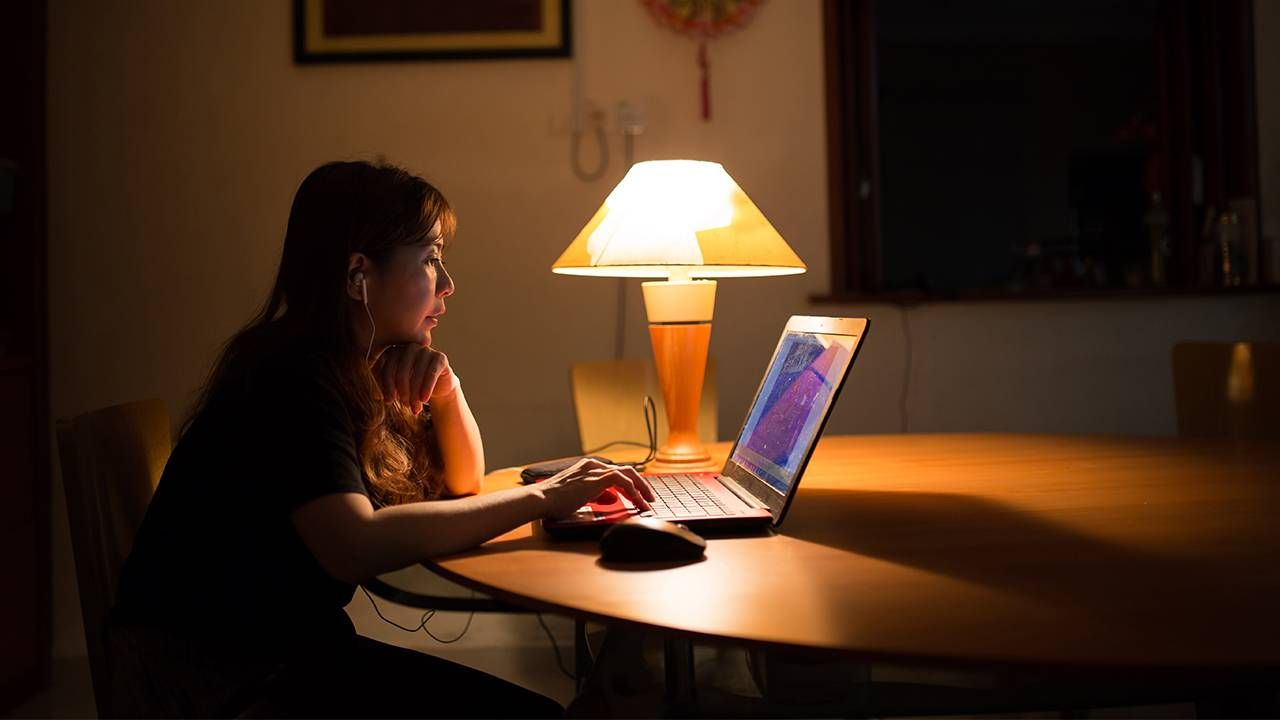 An older adult sitting at a laptop. Next Avenue, eye strain computer