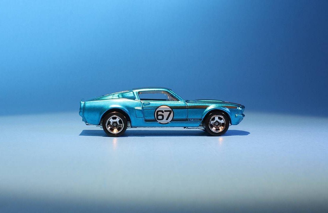 A metalic blue toy model sports car. Next Avenue, mother son project