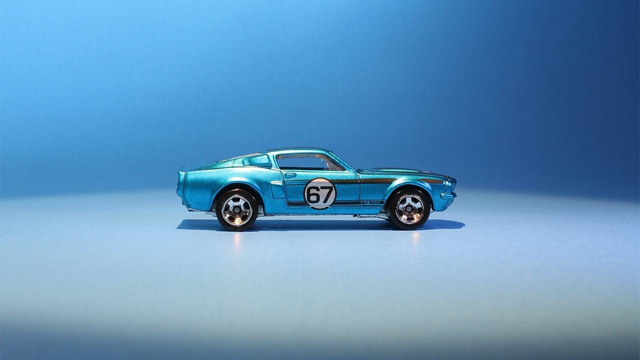 A metalic blue toy model sports car. Next Avenue, mother son project