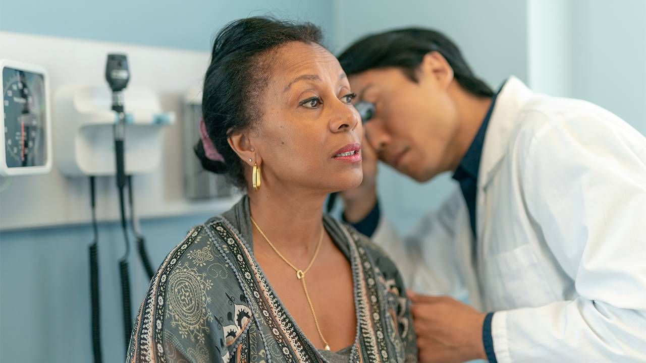 An older adult getting their hearing checked. Next Avenue, sudden hearing loss stories