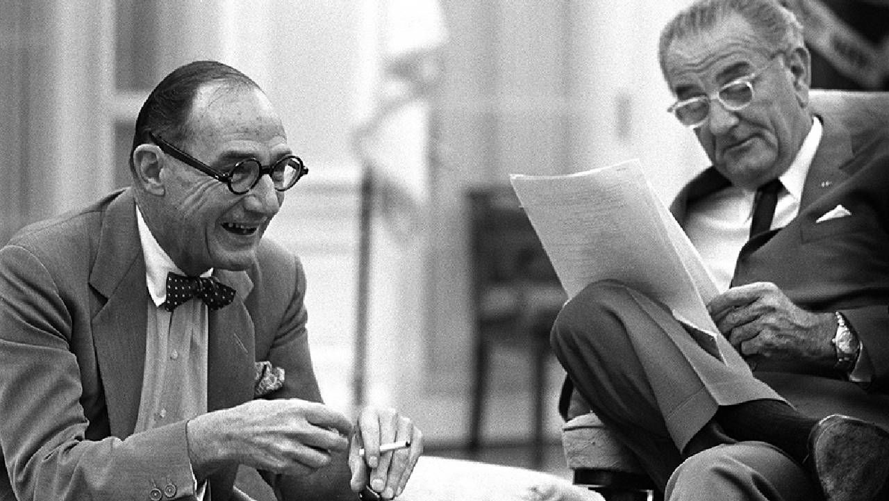 A black and white photo of the journalist sitting next to the former president. Next Avenue, LGBTQ history, Washington d.c.