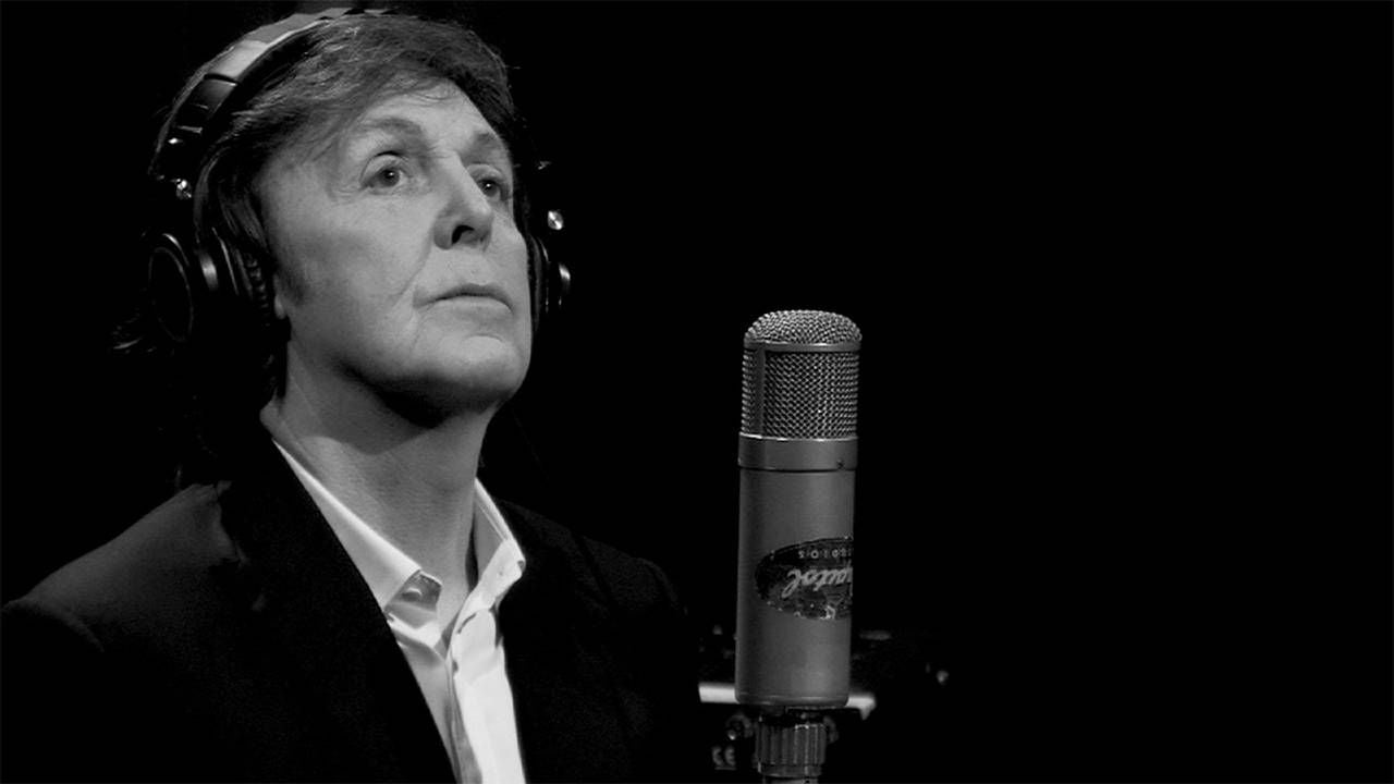 Paul McCartney wearing headphones in a studio. Next Avenue, Paul McCartney turns 80