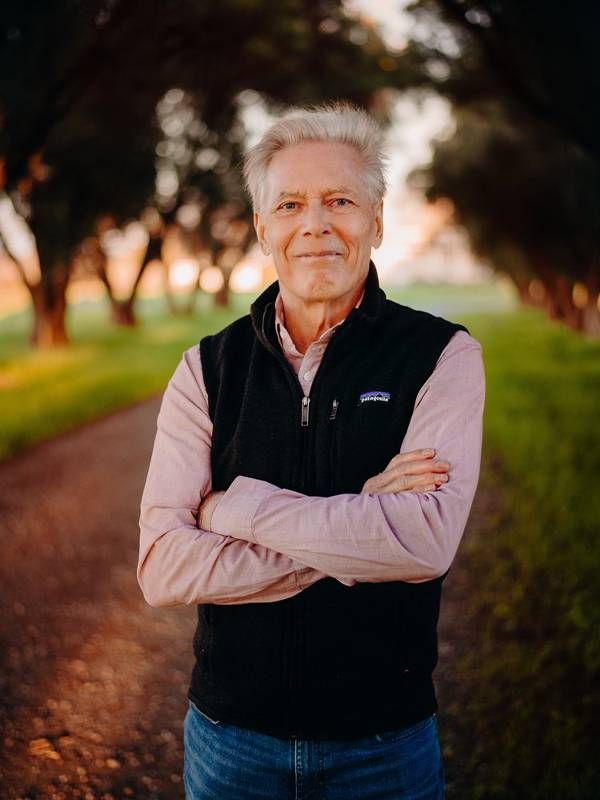 A man standing outside smiling. Next Avenue, Craig McNamara Robert McNamara