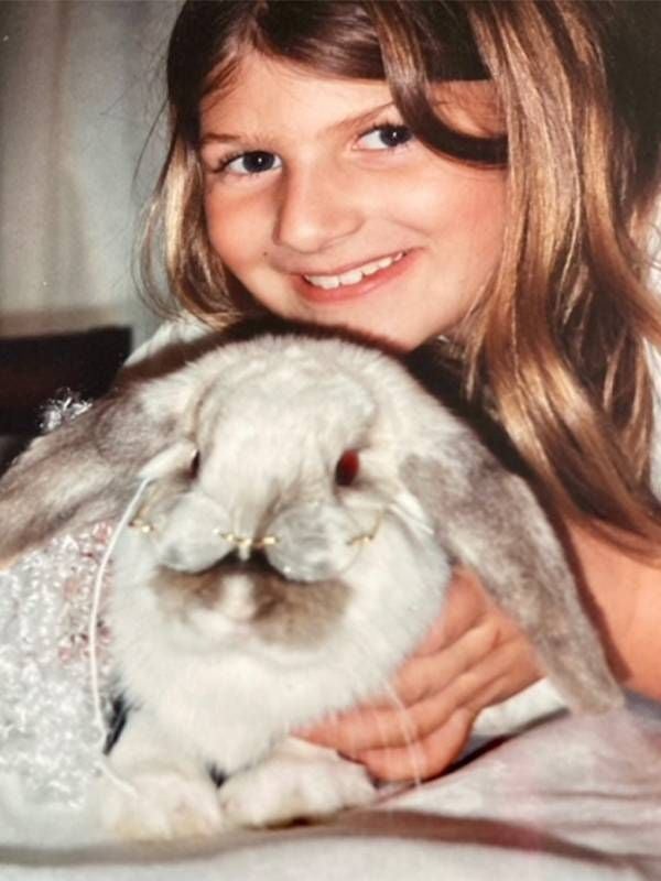 A young girl holding a grey rabbit. Next Avenue, grief disorders