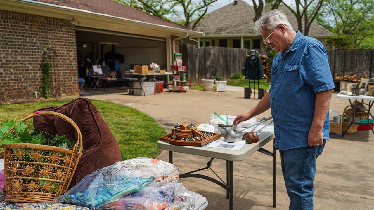 An older man shopping at a yard sale. Next Avenue, Tips Tricks for yard sale, garage sale, tag sale,