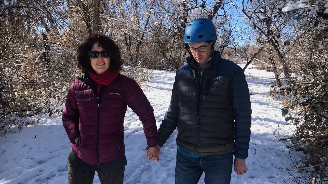 A mother walking on a snowy path with her son. Next Avenue, ward of the state, adults, IDD, developmental disabilities