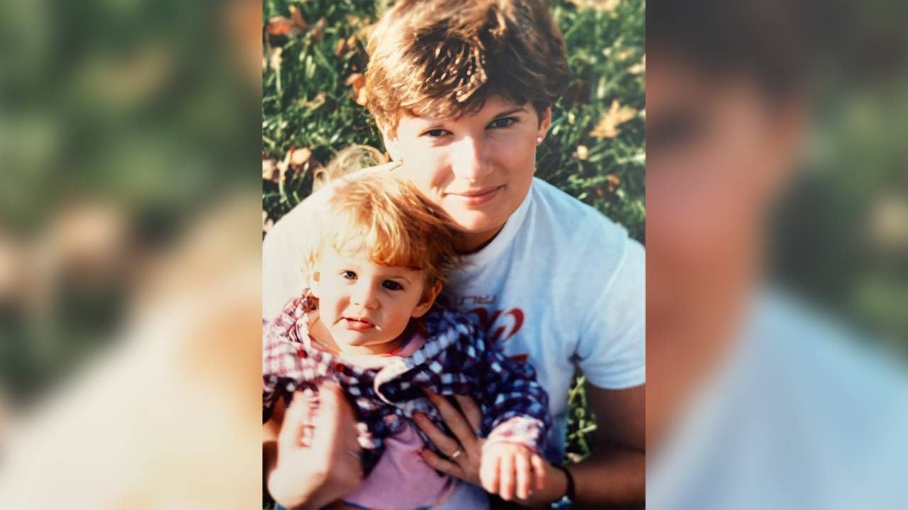 A mother holding her daughter outside. Next Avenue, grief disorders