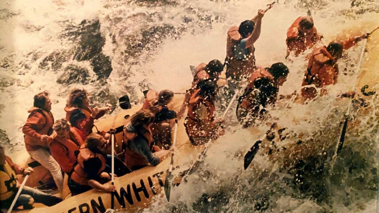 A group of people whitewater rafting. Next Avenue, Life before Title IX, impact of Title IX