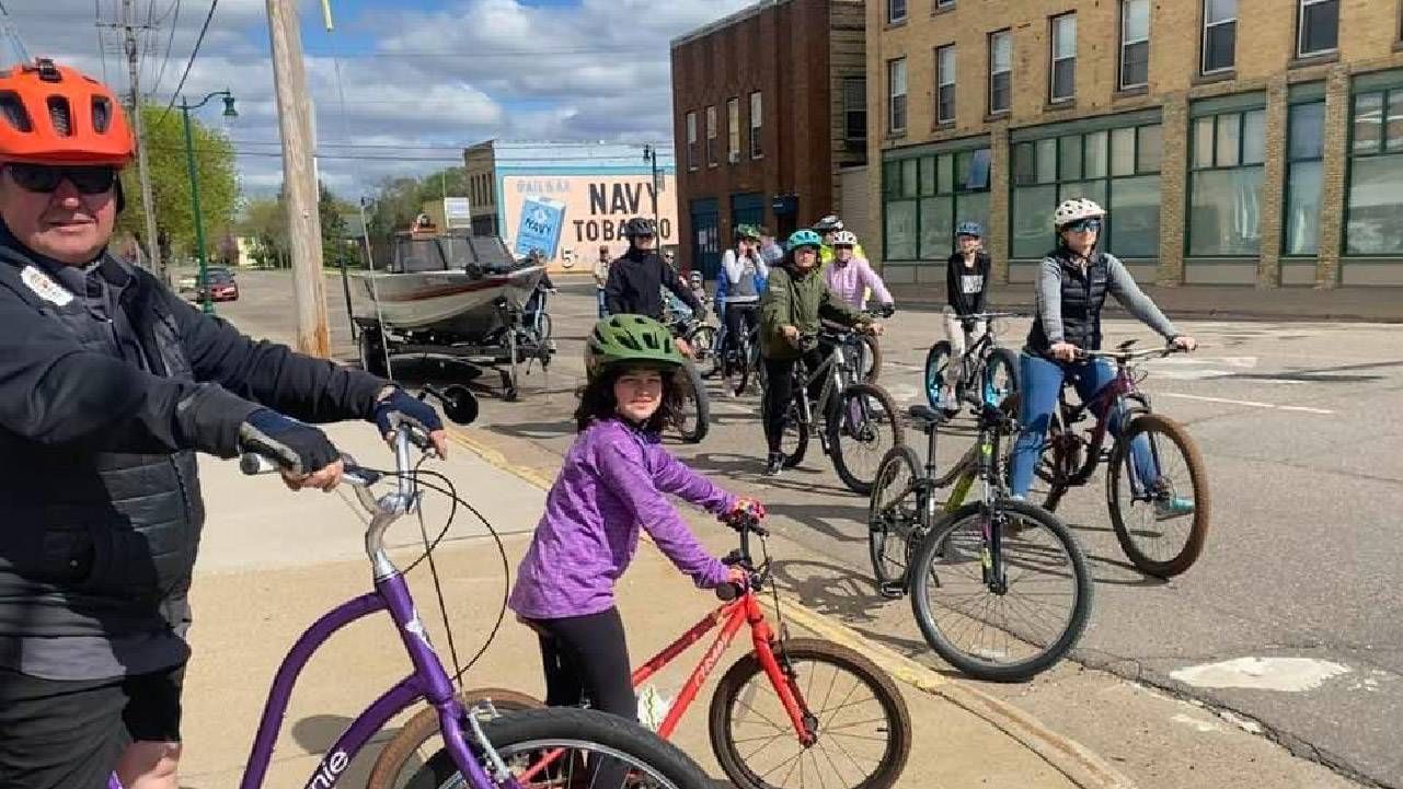 A group of people riding bicycles. Next Avenue, career change, shift