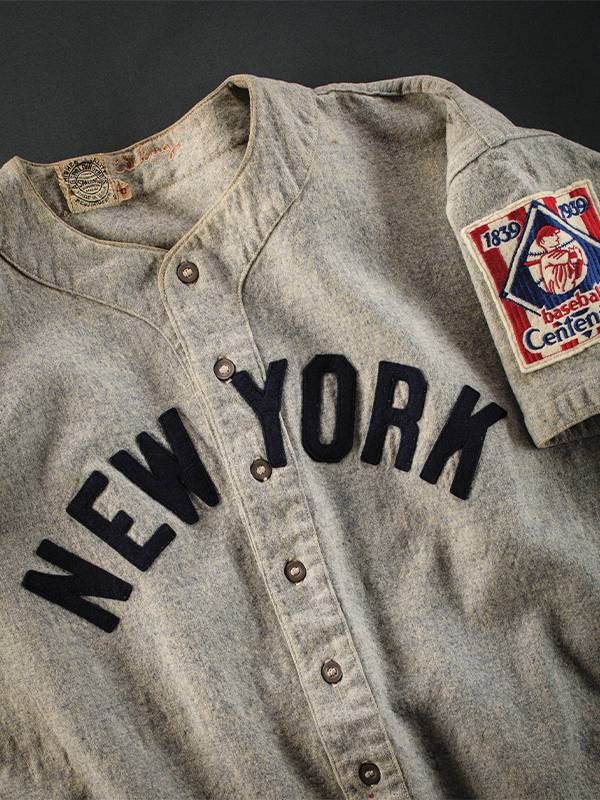 A plain vintage New York Yankees gray baseball uniform.  Next Avenue, Baseball History, National Postal Museum